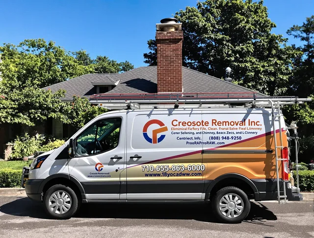 Seekonk Chimney Sweep technician removing creosote safely in Seekonk, MA