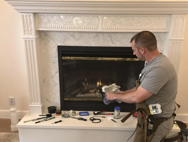 Seekonk Chimney Sweep performing fireplace maintenance in Seekonk, MA