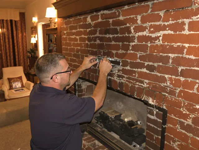 Seekonk Chimney Sweep expert fixing a fireplace in Seekonk, MA